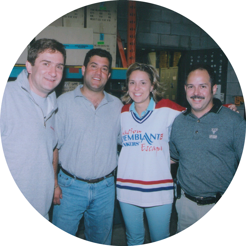 photo of Genumark employees in old warehouse